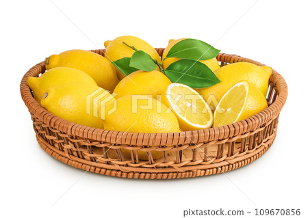 Ripe lemons in wicker basket isolated on white background Ripe lemons in wicker basket isolated on white background 109670856