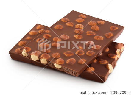 Chocolate with hazelnuts isolated on white background with full depth of field. 109670904