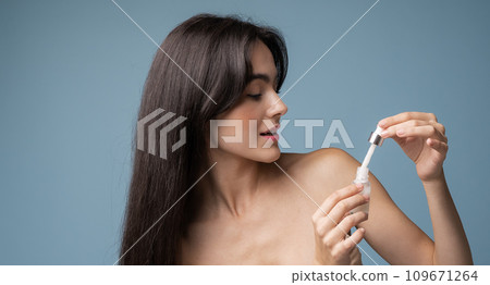 Skin cleaning. Young asian woman standing indoors. High quality photo Skin cleaning. Young asian woman standing indoors. High quality photo 109671264