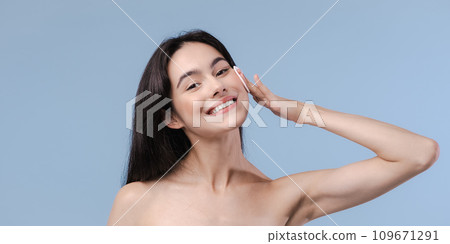 Skin cleaning. Young asian woman standing indoors. High quality photo 109671291