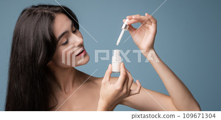 Skin cleaning. Young asian woman standing indoors. High quality photo Skin cleaning. Young asian woman standing indoors. High quality photo 109671304