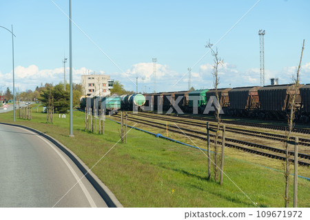 Freight cars stand on the railway waiting to be loaded. Freight cars stand on the railway waiting to be loaded. 109671972