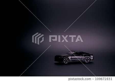 Silhouette of black sports car. Side view on a black background. Copy space. 109672831