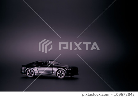 Silhouette of black sports car. Side view on a black background. Copy space. 109672842