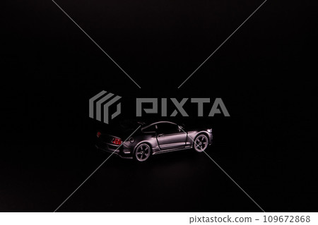 Silhouette of black sports car. Side view on a black background. Copy space. 109672868