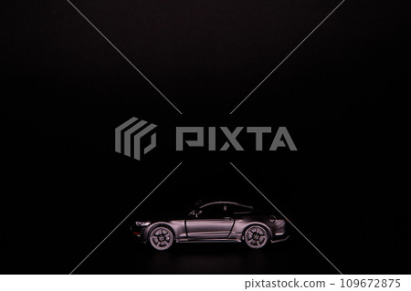 Silhouette of black sports car. Side view on a black background. Copy space. 109672875