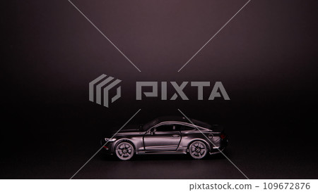 Silhouette of black sports car. Side view on a black background. Copy space. 109672876