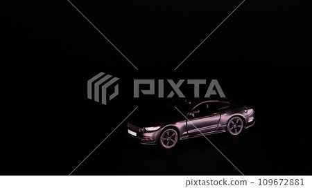 Silhouette of black sports car. Side view on a black background. Copy space. 109672881