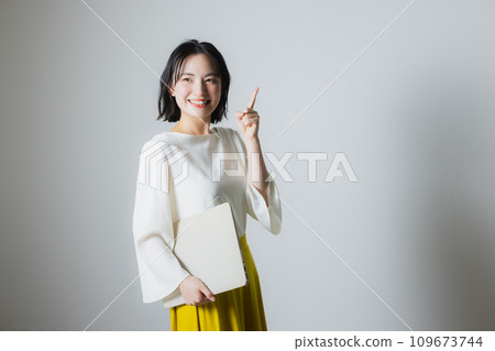A woman with a laptop A woman with a laptop 109673744