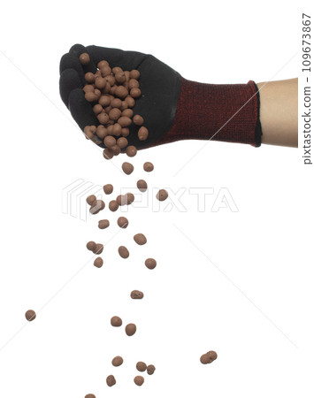 Clay Drainage big size ball pour fall down, explosion in shovel hand. Clay Drainage ball splash in shape form line explosion. White background isolated high speed shutter freeze motion Clay Drainage big size ball pour fall down, explosion in shovel hand. Clay Drainage ball splash in shape form line explosion. White background isolated high speed shutter freeze motion 109673867