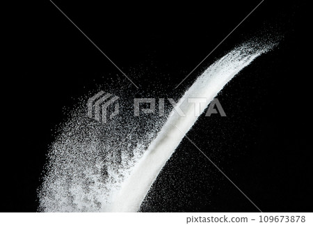 Million of white sand explosion, Photo image of falling down shower snow, heavy snows storm flying. Freeze shot on black background isolated overlay. Tiny Fine Salt sands as particle science 109673878
