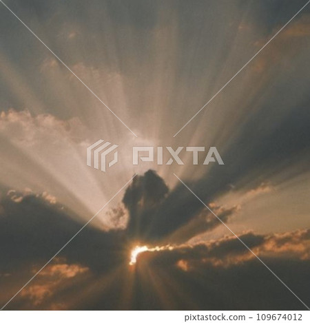 The morning sun shining through the clouds The morning sun shining through the clouds 109674012
