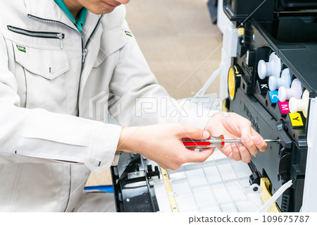 Service man who maintains the copying machine, faceless Service man who maintains the copying machine, faceless 109675787