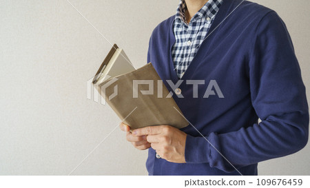 A man reading a book A man reading a book 109676459