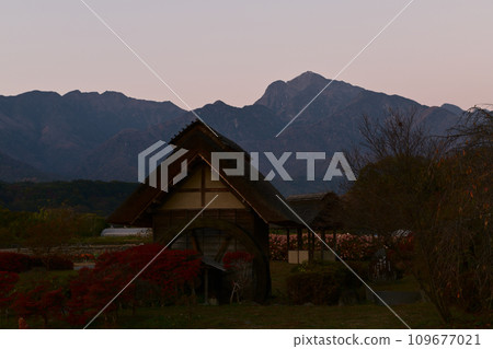 Kaikomagatake at sunrise across from the watermill at the watermill park in Takegawa-cho, Hokuto City 109677021