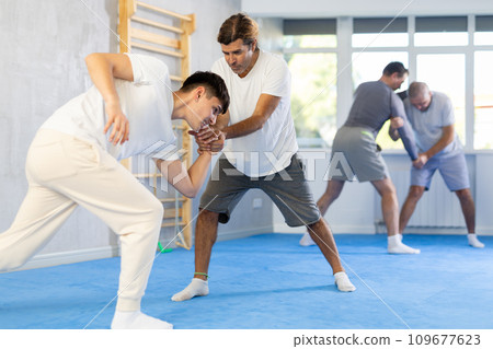 Two men training judo technique in studio 109677623