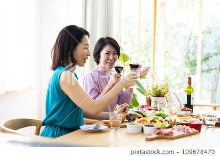 Women enjoying a home party Women enjoying a home party 109678470