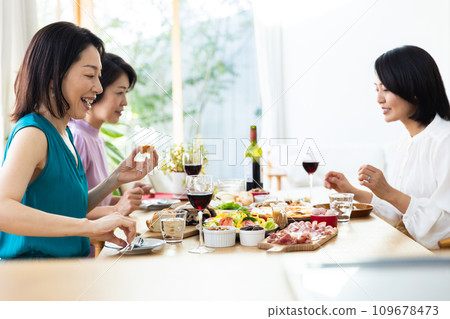 Women enjoying a home party Women enjoying a home party 109678473