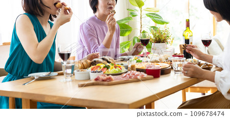Women enjoying a home party Women enjoying a home party 109678474