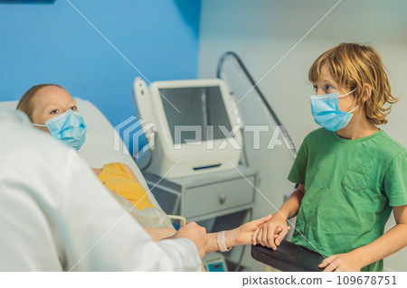 a pregnant mother's ultrasound visit, sharing the excitement with her son who eagerly awaits the arrival of his baby brother. A heartwarming portrayal of family bonds and the anticipation of new a pregnant mother's ultrasound visit, sharing the excitement with her son who eagerly awaits the arrival of his baby brother. A heartwarming portrayal of family bonds and the anticipation of new 109678751