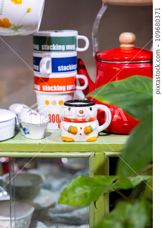 Christmas pottery ceramic on shelve in small craft store. Christmas pottery ceramic on shelve in small craft store. 109680371