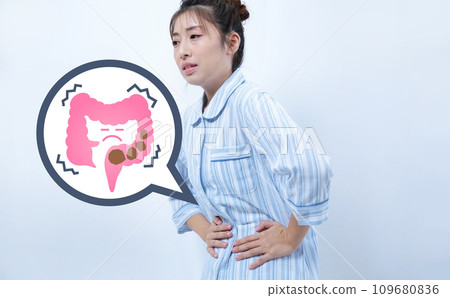 Image of a woman in pajamas with severe constipation Image of a woman in pajamas with severe constipation 109680836