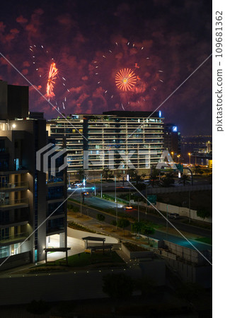 Al Raha Beach at Night with Fireworks Display over Yas Island in Abu Dhabi Al Raha Beach at Night with Fireworks Display over Yas Island in Abu Dhabi 109681362