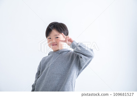 Boy giving peace sign Missing teeth Boy giving peace sign Missing teeth 109681527