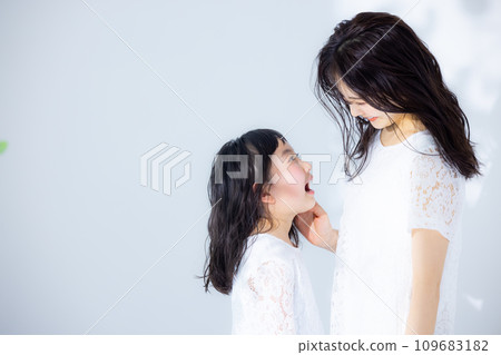 Girl hugging her mother 109683182