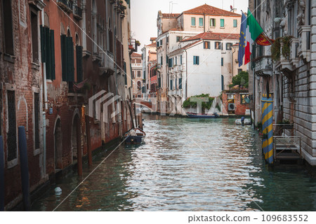 Scenic view of a canal in Venice, Italy. This image is part of a collection highlighting the beauty of Venice during the summer season. Scenic view of a canal in Venice, Italy. This image is part of a collection highlighting the beauty of Venice during the summer season. 109683552