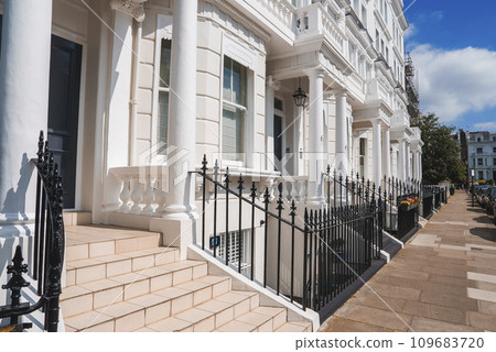 Steps of luxurious property in Pembridge Gardens. Modern residential house by footpath. Apartment in London on sunny day. Steps of luxurious property in Pembridge Gardens. Modern residential house by footpath. Apartment in London on sunny day. 109683720