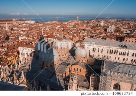 Aerial view of Venice, Italy showcasing iconic canals, historic buildings, and gondolas. The city's unique layout, classic Venetian architecture, and romantic atmosphere 109683784