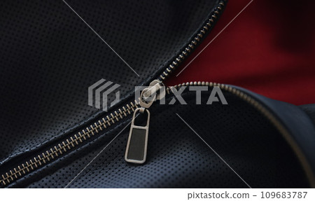 Closeup of zipper on blue leather jacket Closeup of zipper on blue leather jacket 109683787
