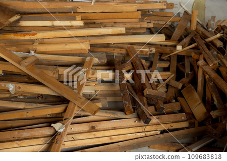 A demolished abandoned house piled with scrap materials A demolished abandoned house piled with scrap materials 109683818