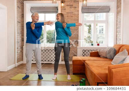 Senior Couple Doing Stretching Exercise 109684431
