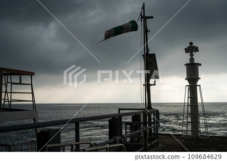 Telephone pole jutting into Lake Biwa 109684629