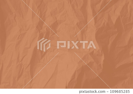 Crumpled paper Peach Fuzz color of the year 2024. Texture crumpled paper for your design. Copy space. 109685285