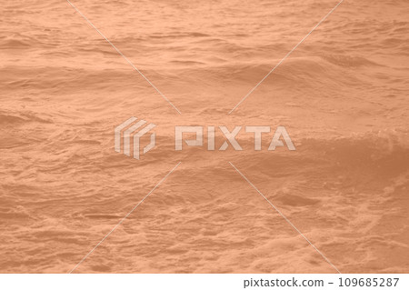 Peach Fuzz toned sea water texture. Pool water with sun reflections. Trendy colour 2024 year. Peach Fuzz toned sea water texture. Pool water with sun reflections. Trendy colour 2024 year. 109685287