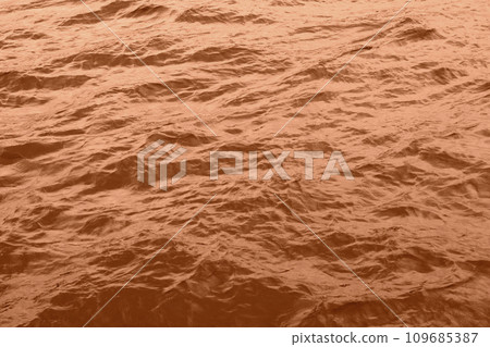 Peach Fuzz toned sea water texture. Pool water with sun reflections. Trendy colour 2024 year. Peach Fuzz toned sea water texture. Pool water with sun reflections. Trendy colour 2024 year. 109685387