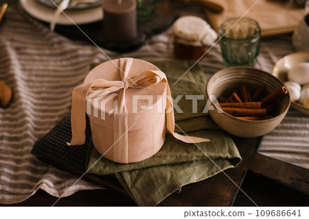 Gift box is on the dining table on a napkin 109686641