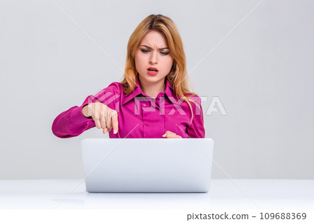 young woman sitting in the table and using laptop young woman sitting in the table and using laptop 109688369