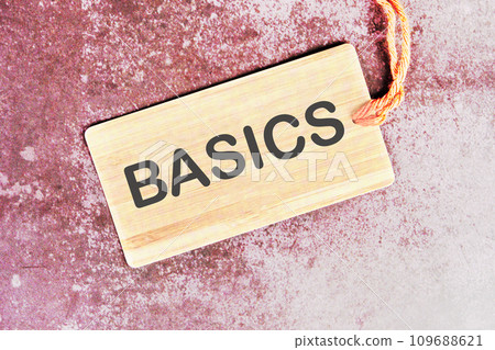 BASICS word written on a card with a rope on an abstract background BASICS word written on a card with a rope on an abstract background 109688621