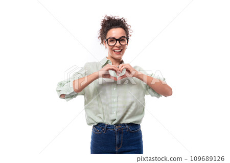 young confident leader woman with curly black hair puts on a shirt and jeans to the office young confident leader woman with curly black hair puts on a shirt and jeans to the office 109689126