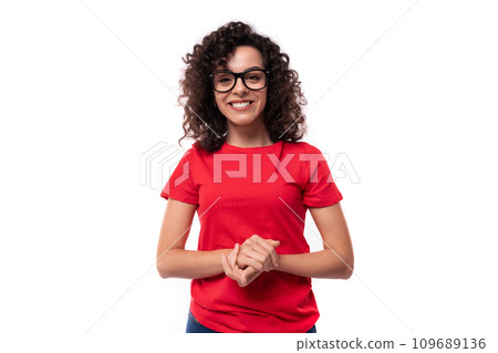 close-up of a caucasian young pretty curly brunette woman in a red t-shirt close-up of a caucasian young pretty curly brunette woman in a red t-shirt 109689136