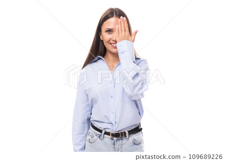 charming young brunette european woman dressed in blue shirt and jeans over isolated background with charming young brunette european woman dressed in blue shirt and jeans over isolated background with 109689226