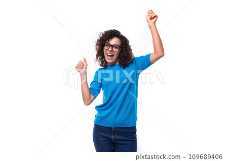 young slender curly woman with black hair is dressed in a blue t-shirt with an identity mockup 109689406
