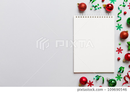 Christmas blank greeting card mock-up scene. Creative layout made of Christmas tree branches and paper card note. Flat lay. Nature New Year concept Christmas blank greeting card mock-up scene. Creative layout made of Christmas tree branches and paper card note. Flat lay. Nature New Year concept 109690546