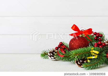 New Year Christmas tree toy, branches of a christmas tree, New Year decorations on a colored background New Year Christmas tree toy, branches of a christmas tree, New Year decorations on a colored background 109690908