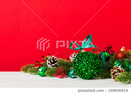 New Year Christmas tree toy, branches of a christmas tree, New Year decorations on a colored background New Year Christmas tree toy, branches of a christmas tree, New Year decorations on a colored background 109690919