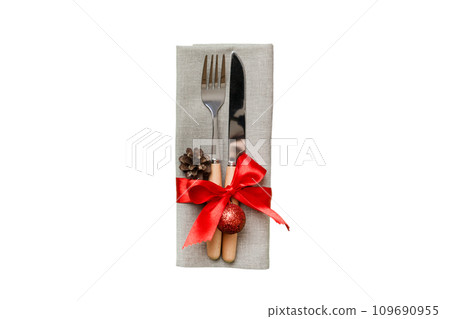 isolated christmas Plate with decor and fork and spoon. New year holiday background. Top view 109690955
